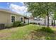 Spacious backyard with fire pit area, easy access to the covered patio, and lush green grass at 116 Hurst Ct, Deland, FL 32724