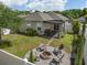 An outdoor patio with a fire pit and seating, perfect for outdoor entertaining at 116 Hurst Ct, Deland, FL 32724