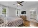 Bright bedroom with hardwood floors, large windows, and an en-suite bathroom, offering a serene retreat at 116 Hurst Ct, Deland, FL 32724