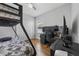 Modern bedroom with a bunk bed, desk, and ample workspace at 116 Hurst Ct, Deland, FL 32724