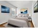 Serene bedroom featuring neutral tones, plush bedding, and stylish artwork at 116 Hurst Ct, Deland, FL 32724