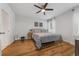 Cozy bedroom with stylish decor, hardwood floors, and natural light, creating a relaxing atmosphere at 116 Hurst Ct, Deland, FL 32724