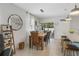 Well-lit dining room featuring a wooden table set, decorative accents, and a view of the backyard at 116 Hurst Ct, Deland, FL 32724