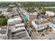 Aerial view of a downtown area with mixed-use buildings, busy streets, and visible rooftop details at 116 Hurst Ct, Deland, FL 32724