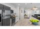 Open-concept kitchen with a large island, stainless appliances, and ample counter space at 116 Hurst Ct, Deland, FL 32724