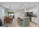 Spacious kitchen and dining area with stainless steel appliances and modern finishes at 116 Hurst Ct, Deland, FL 32724
