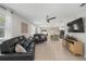 Spacious living room with tile floors that opens up to the eat in kitchen at 116 Hurst Ct, Deland, FL 32724