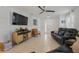 Stylish living room with tile flooring, comfortable couches, and contemporary decor for relaxation at 116 Hurst Ct, Deland, FL 32724