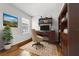 Home office featuring a wood desk, rolling chair, bookshelf, and window at 116 Hurst Ct, Deland, FL 32724