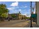 Street view featuring a historic building with columns and a dome, complemented by mature trees and street lamps at 116 Hurst Ct, Deland, FL 32724