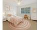 Charming bedroom with a cozy bed, cheerful decor, and playful accents at 1209 Stevens Ave, Orlando, FL 32806
