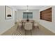 Cozy dining room with a round table, comfortable chairs, and stylish decor, perfect for gatherings at 1209 Stevens Ave, Orlando, FL 32806