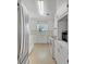 Clean and bright kitchen featuring white cabinetry and modern appliances for convenience at 1209 Stevens Ave, Orlando, FL 32806