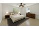 Serene primary bedroom with neutral colors, large windows, and tasteful furnishings at 1209 Stevens Ave, Orlando, FL 32806
