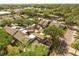 Aerial view displaying the layout of the neighborhood with various townhomes surrounded by lush trees and winding roads at 121 Teriwood St, Fern Park, FL 32730