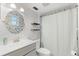 Bathroom with decorative mirror above the sink and a shower with a white curtain at 121 Teriwood St, Fern Park, FL 32730