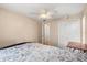 Bedroom with ceiling fan, double closet, and entry to bathroom at 121 Teriwood St, Fern Park, FL 32730