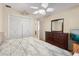 Bedroom featuring ceiling fan, a closet and entry to a bathroom at 121 Teriwood St, Fern Park, FL 32730