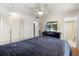 Comfortable bedroom featuring double closet, ceiling fan, and connecting bathroom at 121 Teriwood St, Fern Park, FL 32730