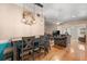 Cozy dining area with hardwood floors, stylish lighting fixtures, and a view into the adjacent living room at 121 Teriwood St, Fern Park, FL 32730