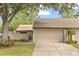 Charming single-Gathering home featuring a two-car garage and well-maintained front yard at 121 Teriwood St, Fern Park, FL 32730