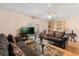 Cozy living room with hardwood floors, comfortable seating, and a view into an adjacent room at 121 Teriwood St, Fern Park, FL 32730
