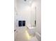 Contemporary powder room featuring stylish patterned floor, sleek vanity with gold fixtures, and a large mirror at 1220 Delaney Park Dr, Orlando, FL 32806