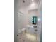 Contemporary bathroom featuring patterned tile floor, glass shower and high end brass fixtures at 1220 Delaney Park Dr, Orlando, FL 32806