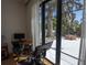 View from bedroom features a home gym and an open patio with mature tree at 1220 Delaney Park Dr, Orlando, FL 32806