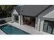 An aerial shot shows the house, an indoor/outdoor entertaining space, and a beautiful pool at 1220 Delaney Park Dr, Orlando, FL 32806