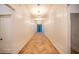 Bright hallway featuring herringbone wood floors, paneling, and modern lighting fixtures at 1220 Delaney Park Dr, Orlando, FL 32806