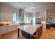 Bright kitchen with marble countertops, island seating, and stainless steel appliances at 1220 Delaney Park Dr, Orlando, FL 32806