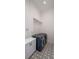 Modern laundry room with contemporary blue front load washer and dryer, and white cabinets at 1220 Delaney Park Dr, Orlando, FL 32806