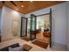 View of kitchen and living area through accordion doors, highlighting the open floor plan and connection of spaces at 1220 Delaney Park Dr, Orlando, FL 32806