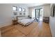 Bright and spacious main bedroom with hardwood floors, large windows, and modern decor at 1220 Delaney Park Dr, Orlando, FL 32806