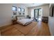 Bright and spacious main bedroom with hardwood floors, large windows, and modern decor at 1220 Delaney Park Dr, Orlando, FL 32806