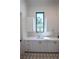 Bright utility room with stylish geometric tile flooring, ample counter space, and storage cabinets at 1220 Delaney Park Dr, Orlando, FL 32806