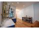Wet bar featuring marble countertop, custom bar shelves, and hardwood floors at 1220 Delaney Park Dr, Orlando, FL 32806