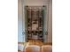 Climate-controlled wine cellar with extensive bottle storage and glass door entry at 1220 Delaney Park Dr, Orlando, FL 32806