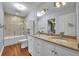 Spacious bathroom offers a double vanity, tub-shower, and modern finishes at 1329 Maury Rd, Orlando, FL 32804
