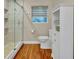 Bathroom with glass enclosed shower, linen closet, and neutral color palette at 1329 Maury Rd, Orlando, FL 32804