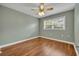Bedroom with hardwood floors, neutral paint, and a window with natural light at 1329 Maury Rd, Orlando, FL 32804