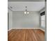 Dining room features wood floors, gray walls, and stylish lighting at 1329 Maury Rd, Orlando, FL 32804