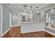 Bright kitchen includes white cabinets and a breakfast bar area at 1329 Maury Rd, Orlando, FL 32804
