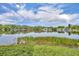 Picturesque lake view showing the houses and greenery, reflecting on the still water at 1329 Maury Rd, Orlando, FL 32804