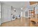 Well-lit laundry room with washer, dryer, sink, and built-in shelving at 1329 Maury Rd, Orlando, FL 32804