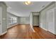 Spacious living room featuring hardwood floors, light walls, and natural light from large windows at 1329 Maury Rd, Orlando, FL 32804
