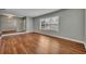 Bright living room features wood floors and a large window at 1329 Maury Rd, Orlando, FL 32804