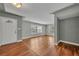 Bright living room featuring beautiful hardwood floors, neutral paint, and a welcoming front door at 1329 Maury Rd, Orlando, FL 32804