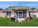 Well-maintained backyard with a screened patio and outdoor kitchen at 1423 Marsh Meadow Ln, Davenport, FL 33896